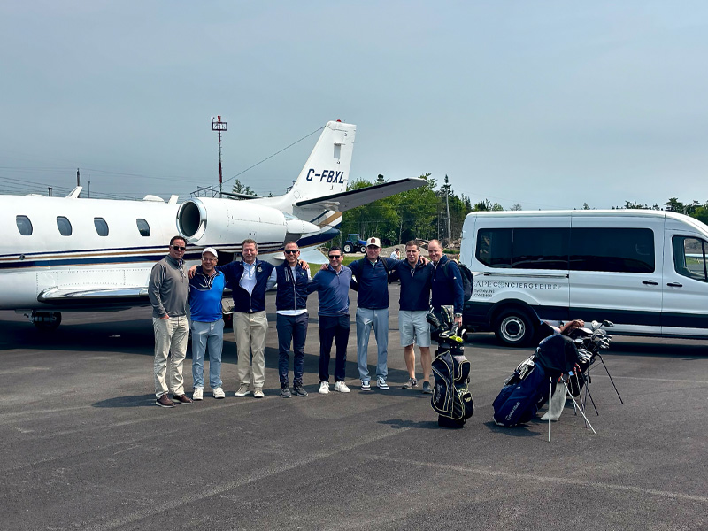 Group arrival beside private jet during Cape Breton air charter experience