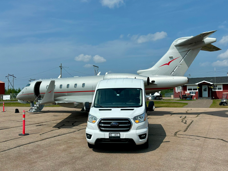 Private transportation van and jet on airport tarmac in Cape Breton Nova Scotia